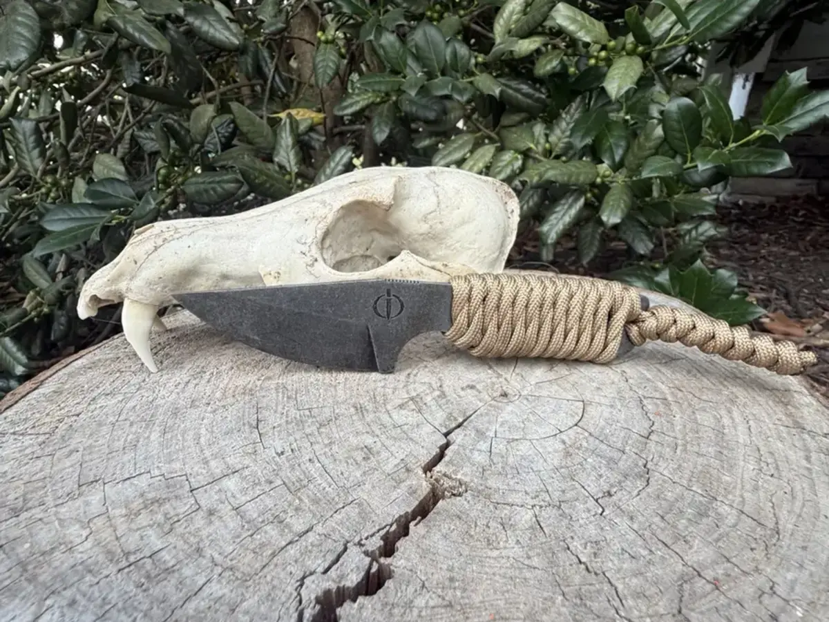 The Mini Crusader with a tan paracord-wrapped handle
