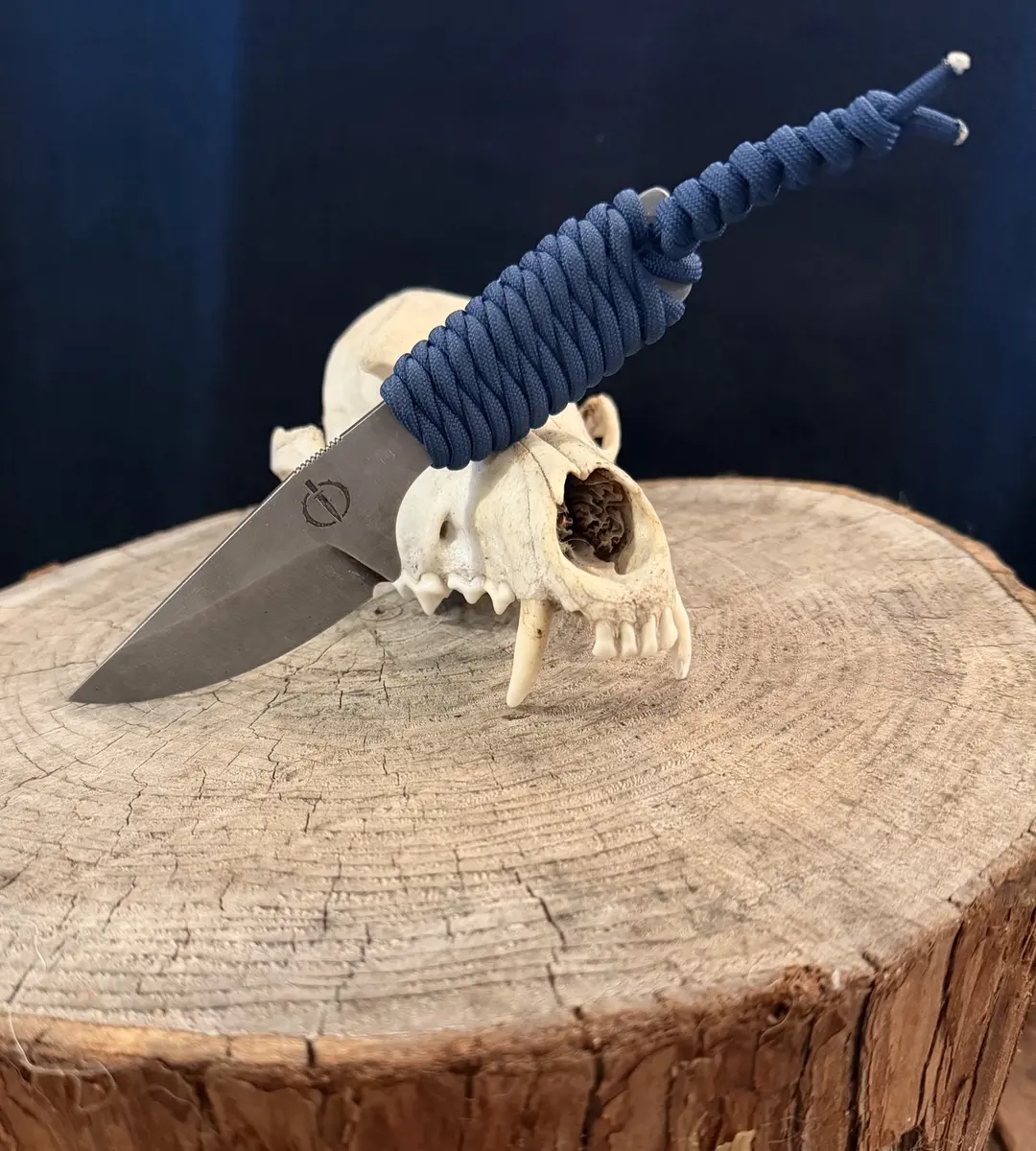 The Mini Crusader with a navy paracord-wrapped handle